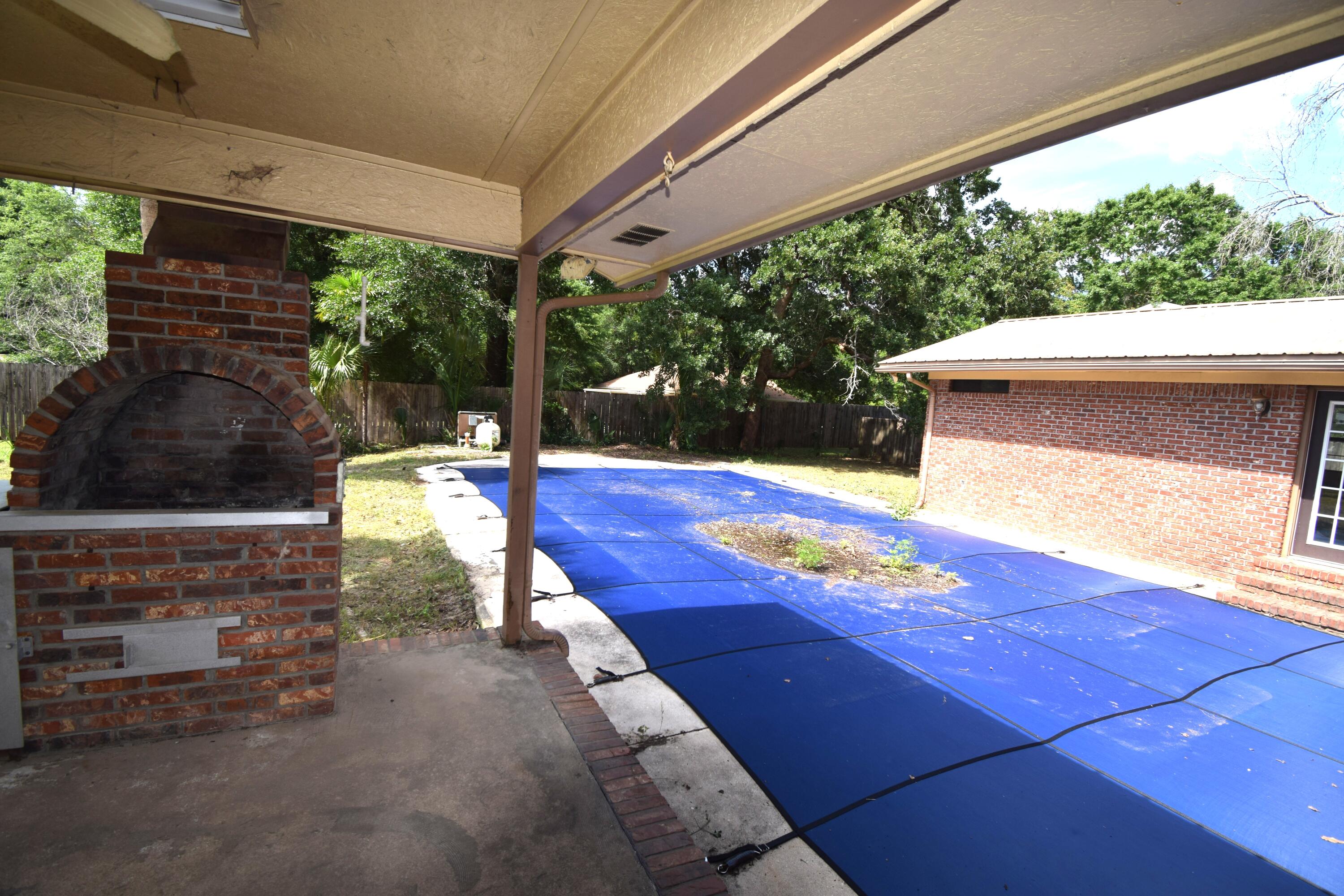 6047 Eden Square Crestview, FL 32539 - Photo 4 of 39 a view of a swimming pool with a patio