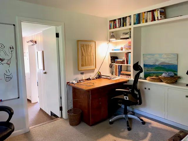 a view of workspace with lounge chair