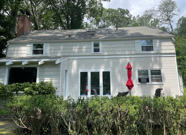 front view of a house with a small yard