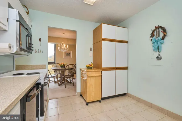 a view of kitchen with furniture and window