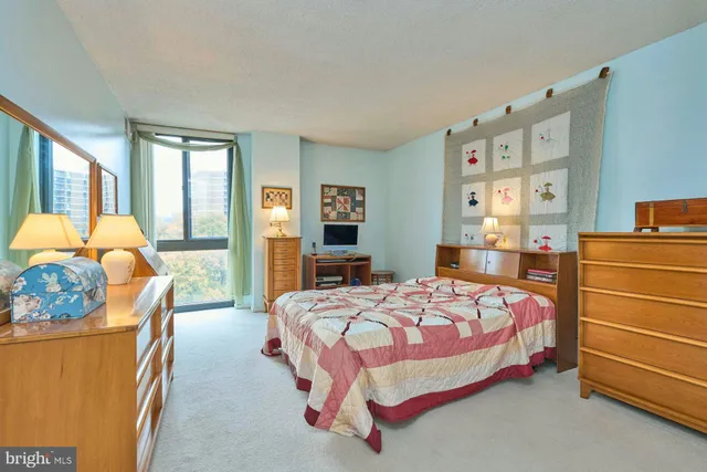 a bedroom with a bed and furniture