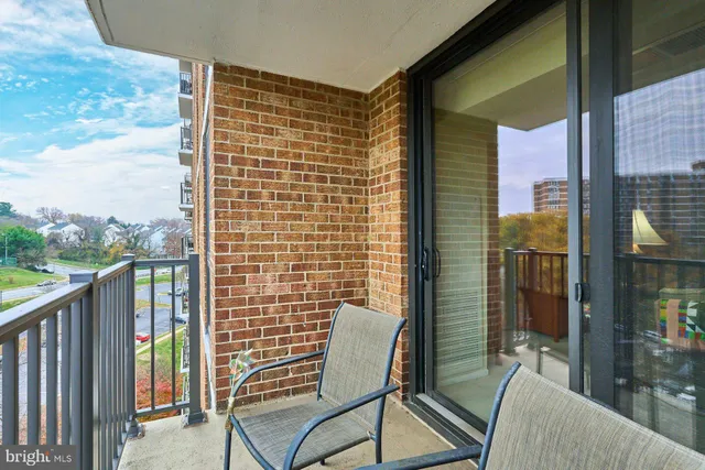 a view of a balcony with chairs