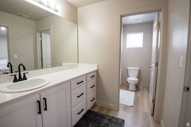 1787 North 1280 East Payson, UT 84651 - Photo 19 of 22 Bathroom featuring a white vanity with integrated sink, black matte faucet, and ample counter space