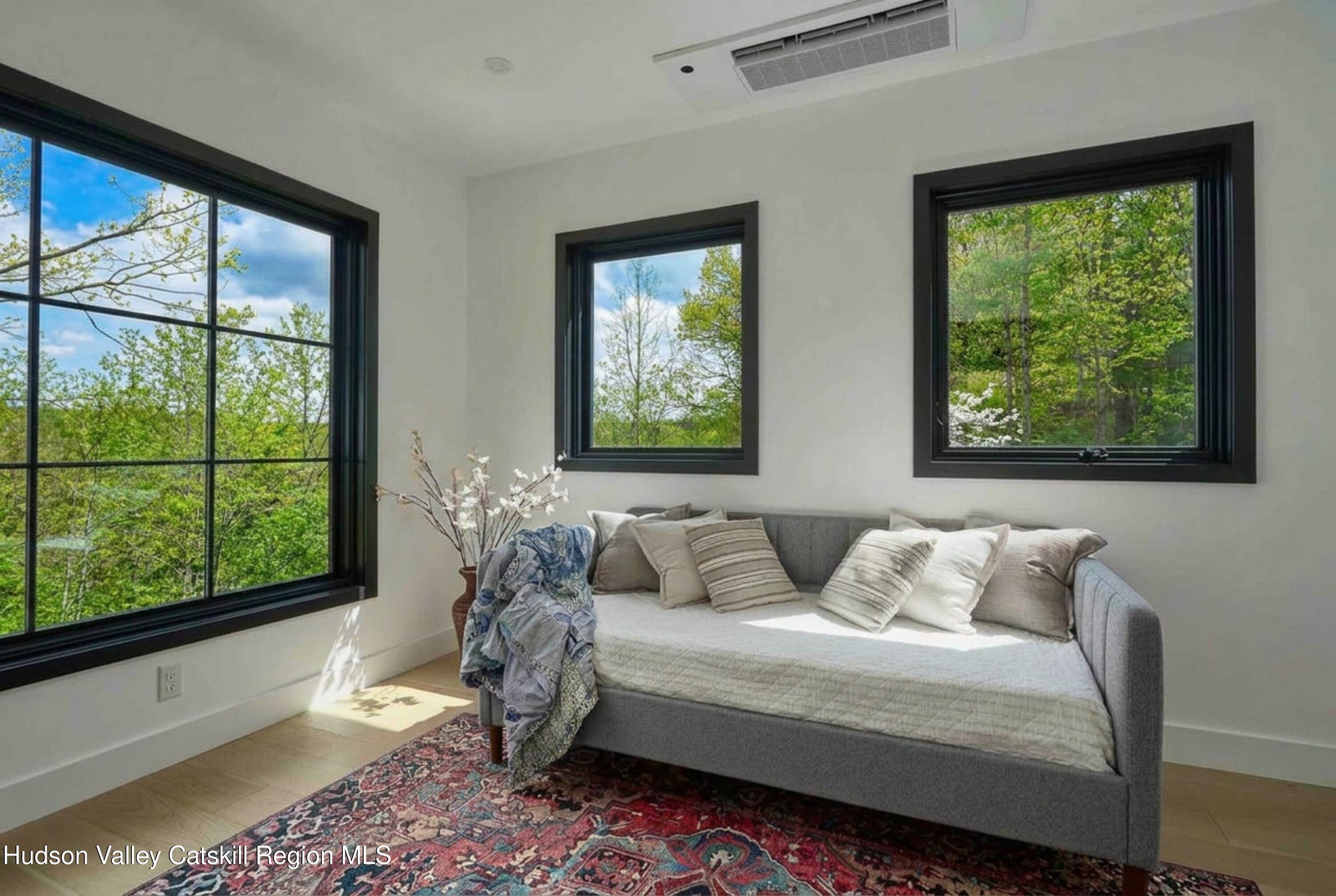 490 Old Rte 82 Hudson, NY 12534 - Photo 29 of 38 a bedroom with a large bed and a large window