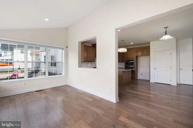 a bathroom with a shower and a glass door