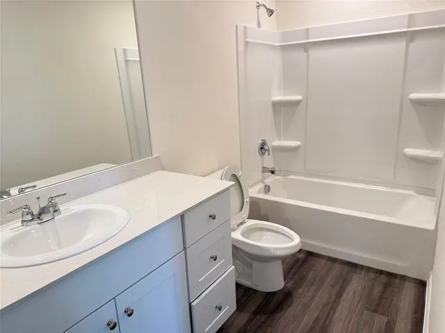 a bathroom with a sink a toilet and a bathtub