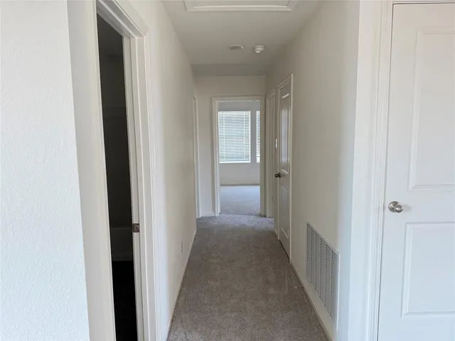 a view of a hallway with a hallway