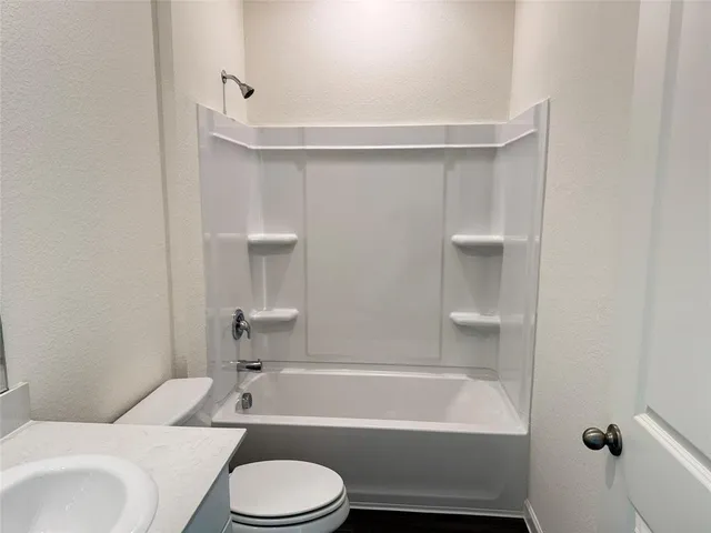 a bathroom with a sink toilet and bathtub