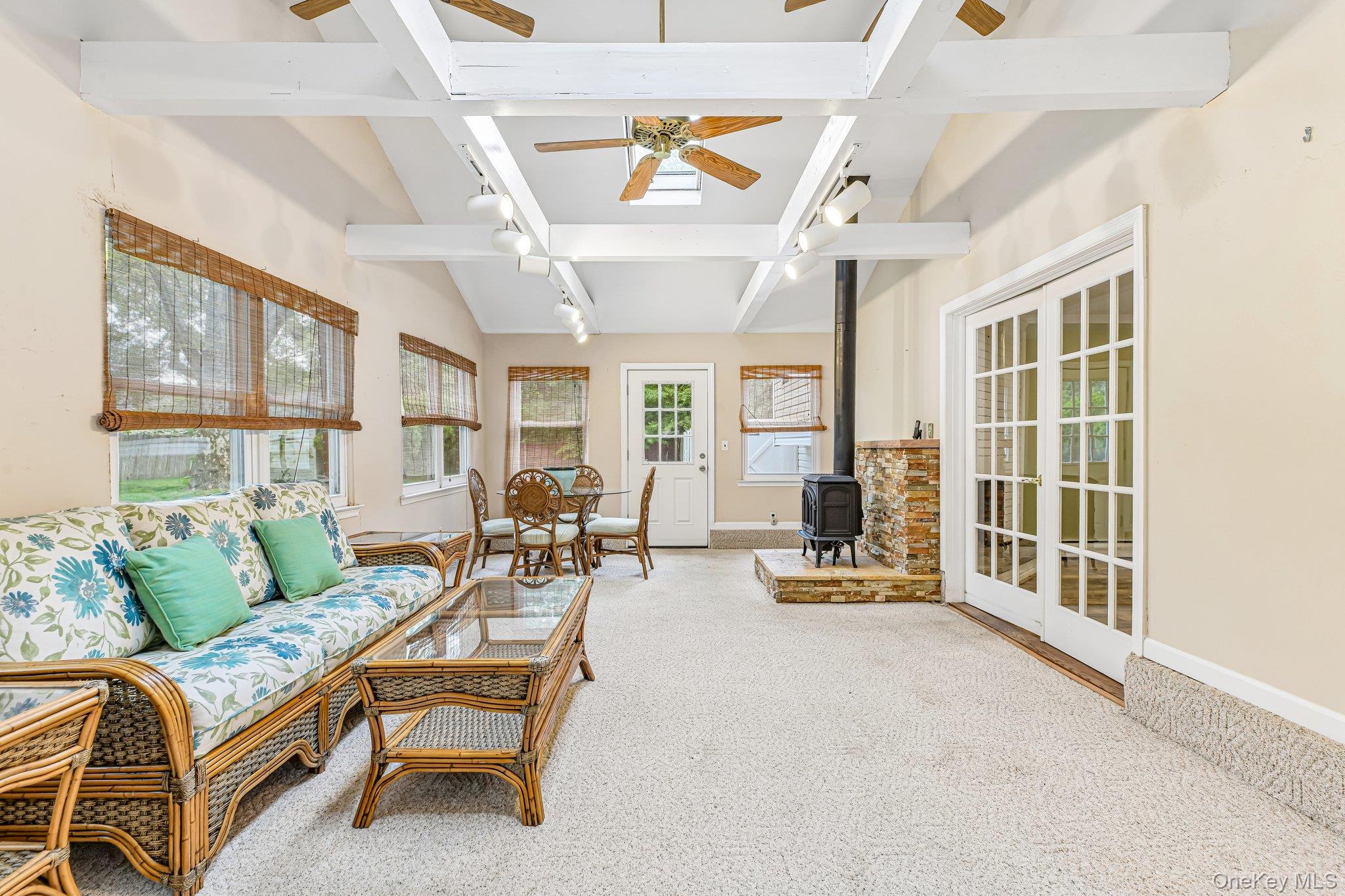 237 Cedar Road East Northport, NY 11731 - Photo 16 of 45 Four seasons room with beamed ceilings, 2 skylights and 2 doors leading out to the yard.