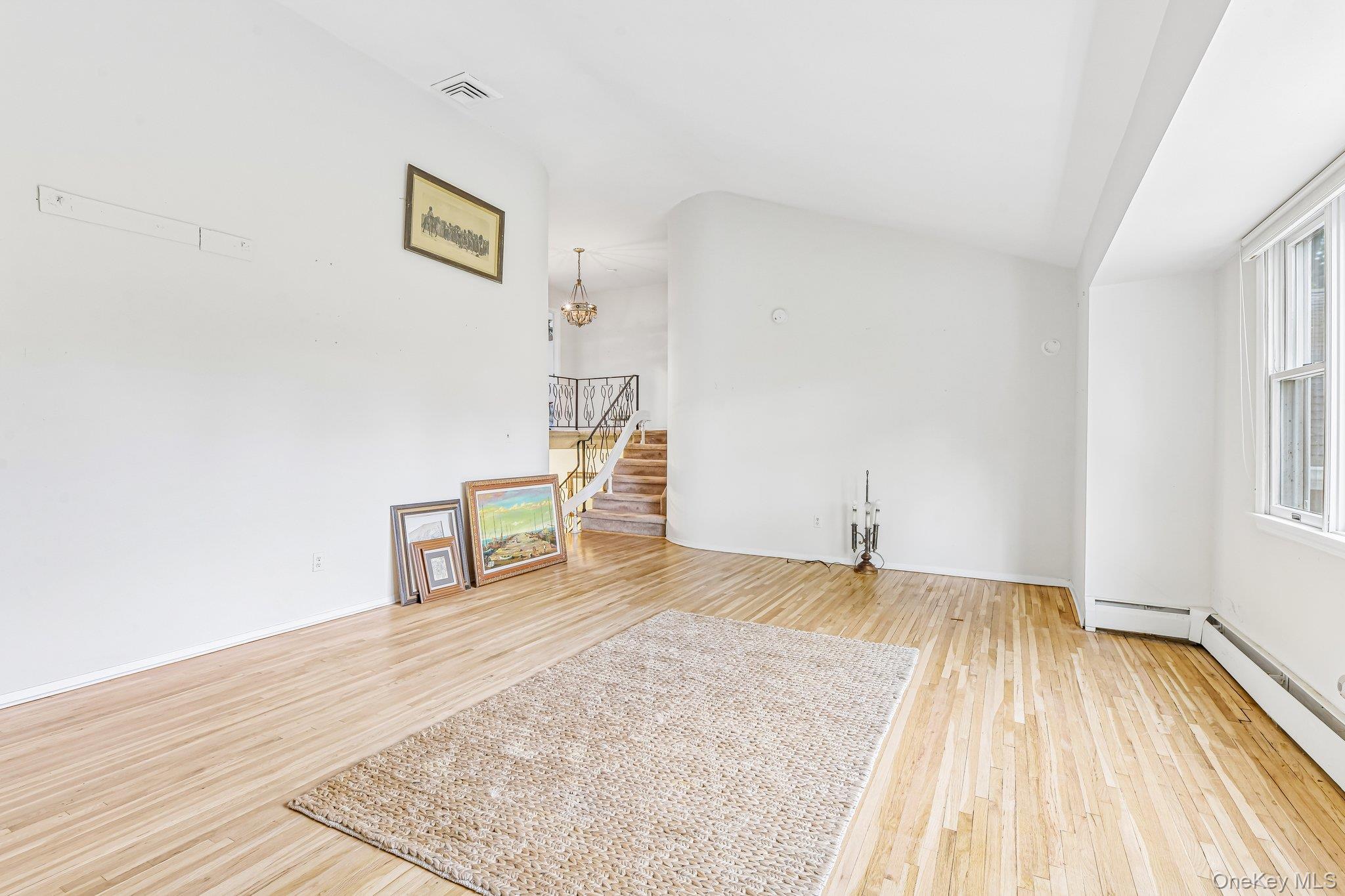 237 Cedar Road East Northport, NY 11731 - Photo 20 of 45 Beautiful hardwood floors just uncovered. Same floors upstairs under carpets.