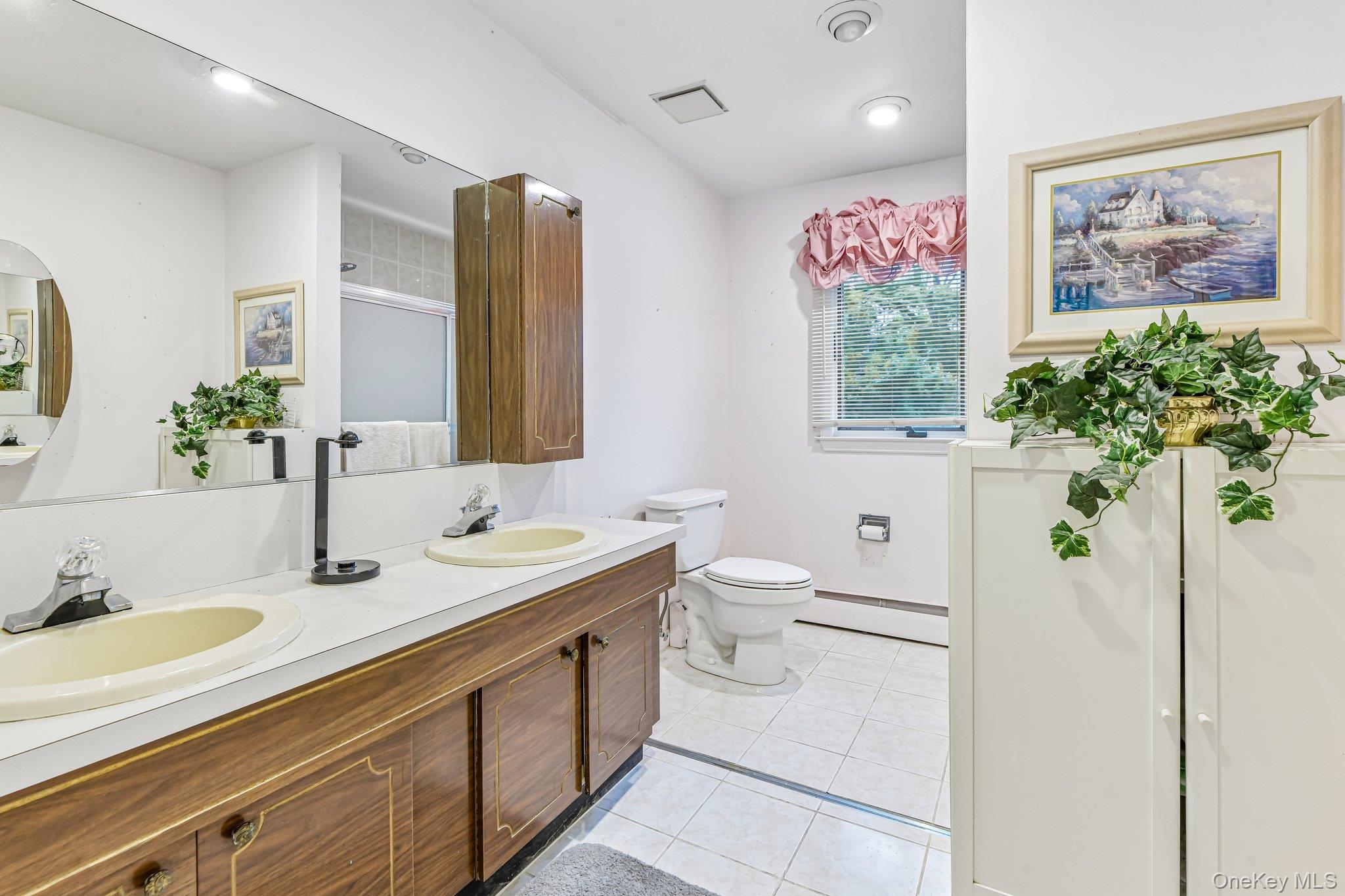 237 Cedar Road East Northport, NY 11731 - Photo 29 of 45 Large bathroom with a tub. Double vanity.