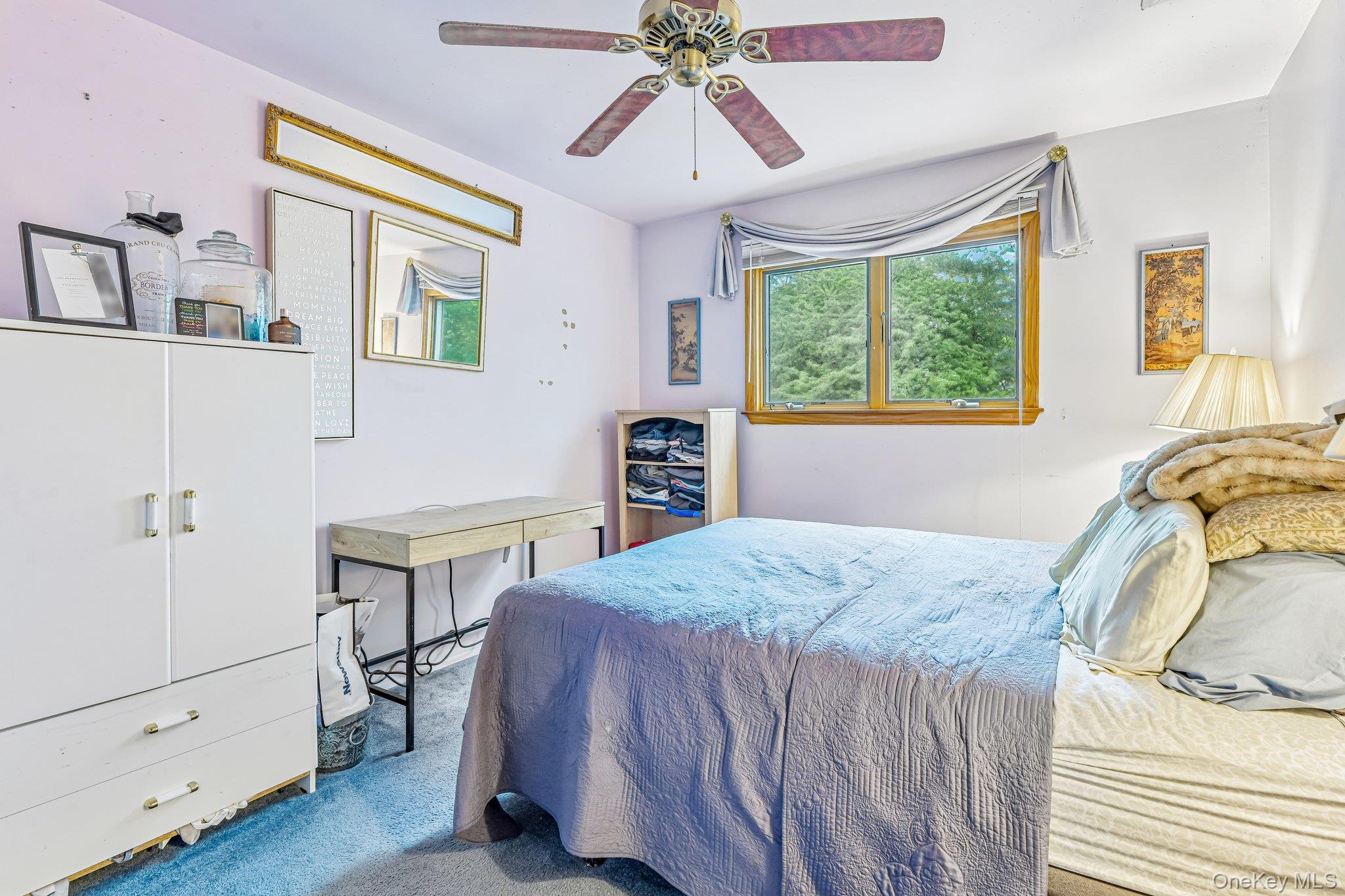 237 Cedar Road East Northport, NY 11731 - Photo 32 of 45 Ceiling fan. Hardwood floors under carpet.