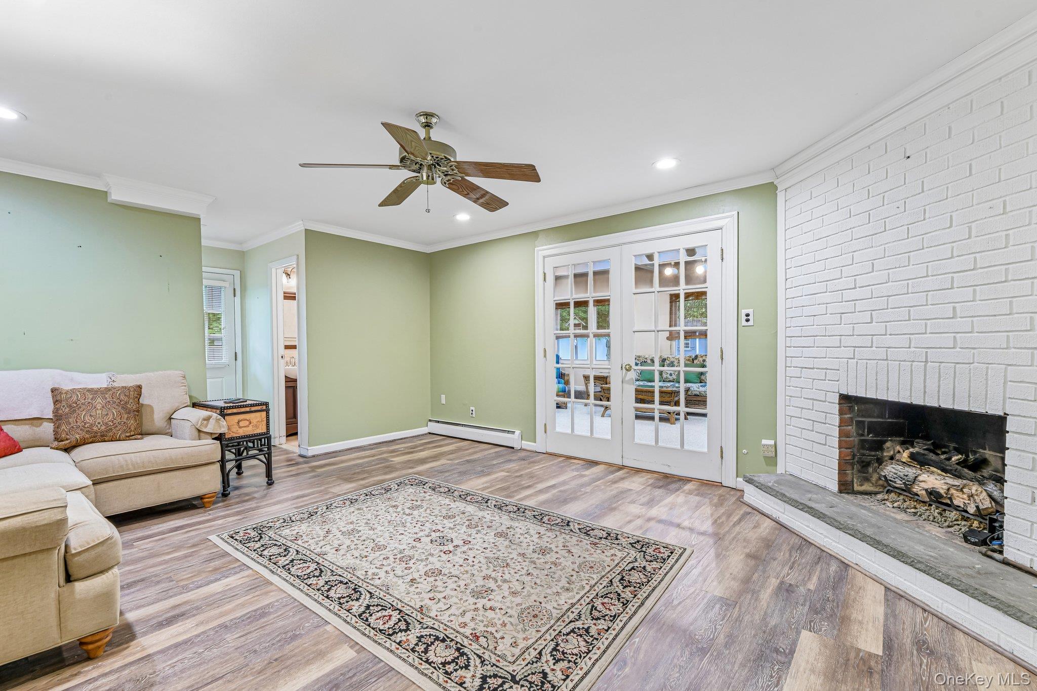 237 Cedar Road East Northport, NY 11731 - Photo 7 of 45 Featuring ceiling fan, recessed lighting, crown molding and inviting gas fpl.