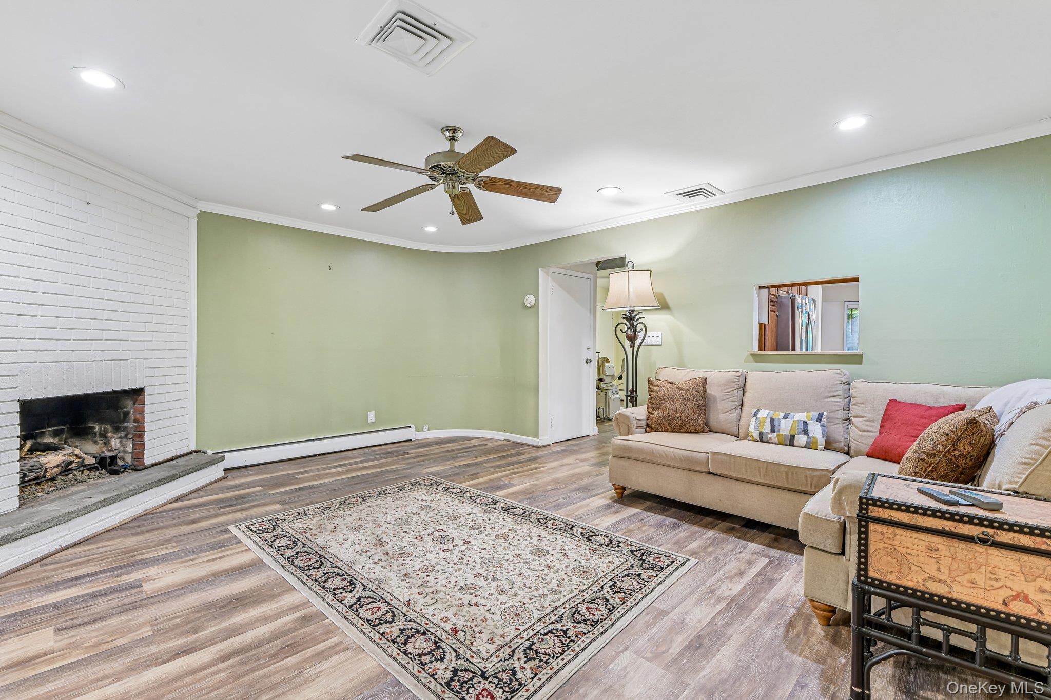 237 Cedar Road East Northport, NY 11731 - Photo 8 of 45 Wood look laminate flooring.