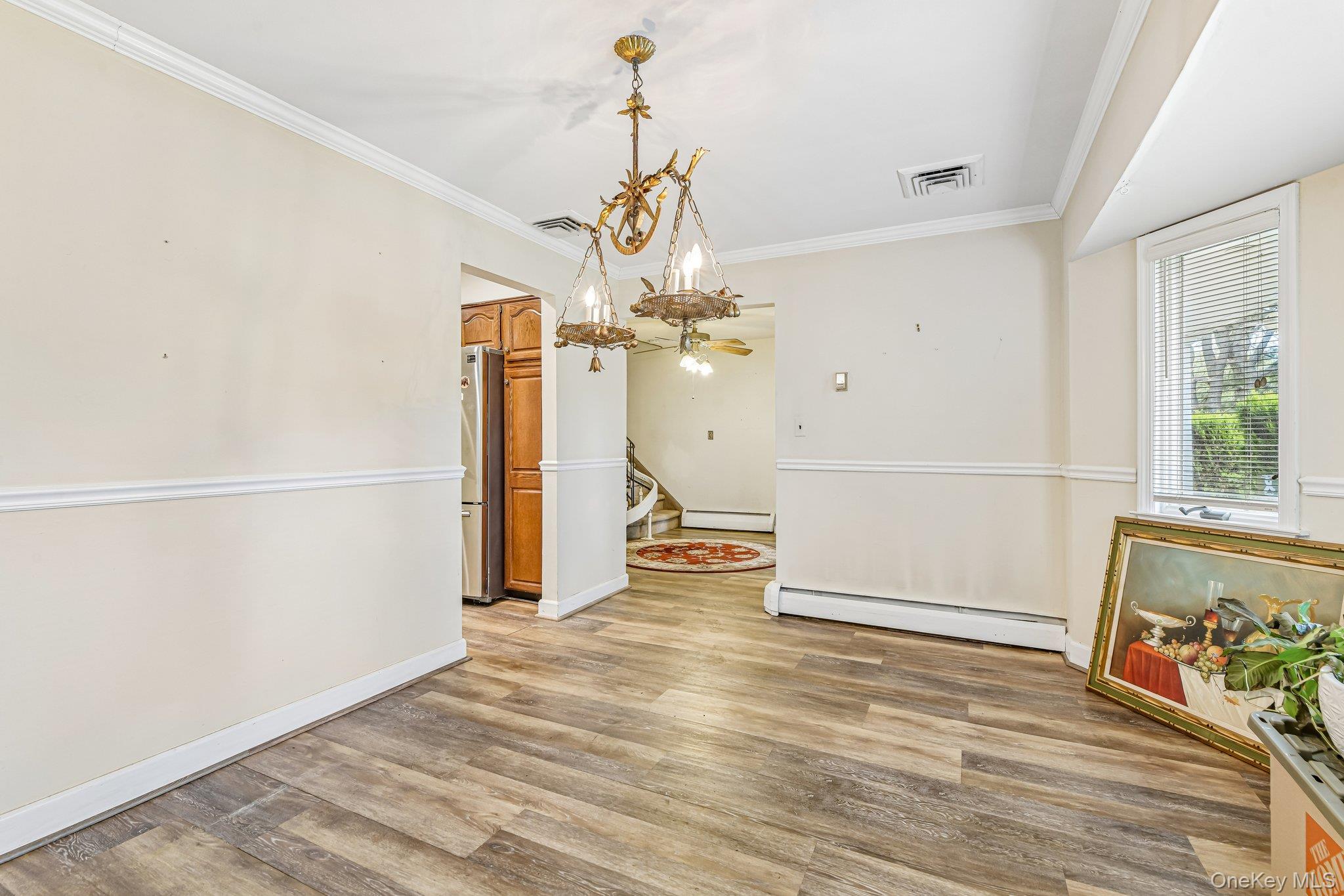 237 Cedar Road East Northport, NY 11731 - Photo 9 of 45 Banquet sized formal dining room with wood look laminate flooring.