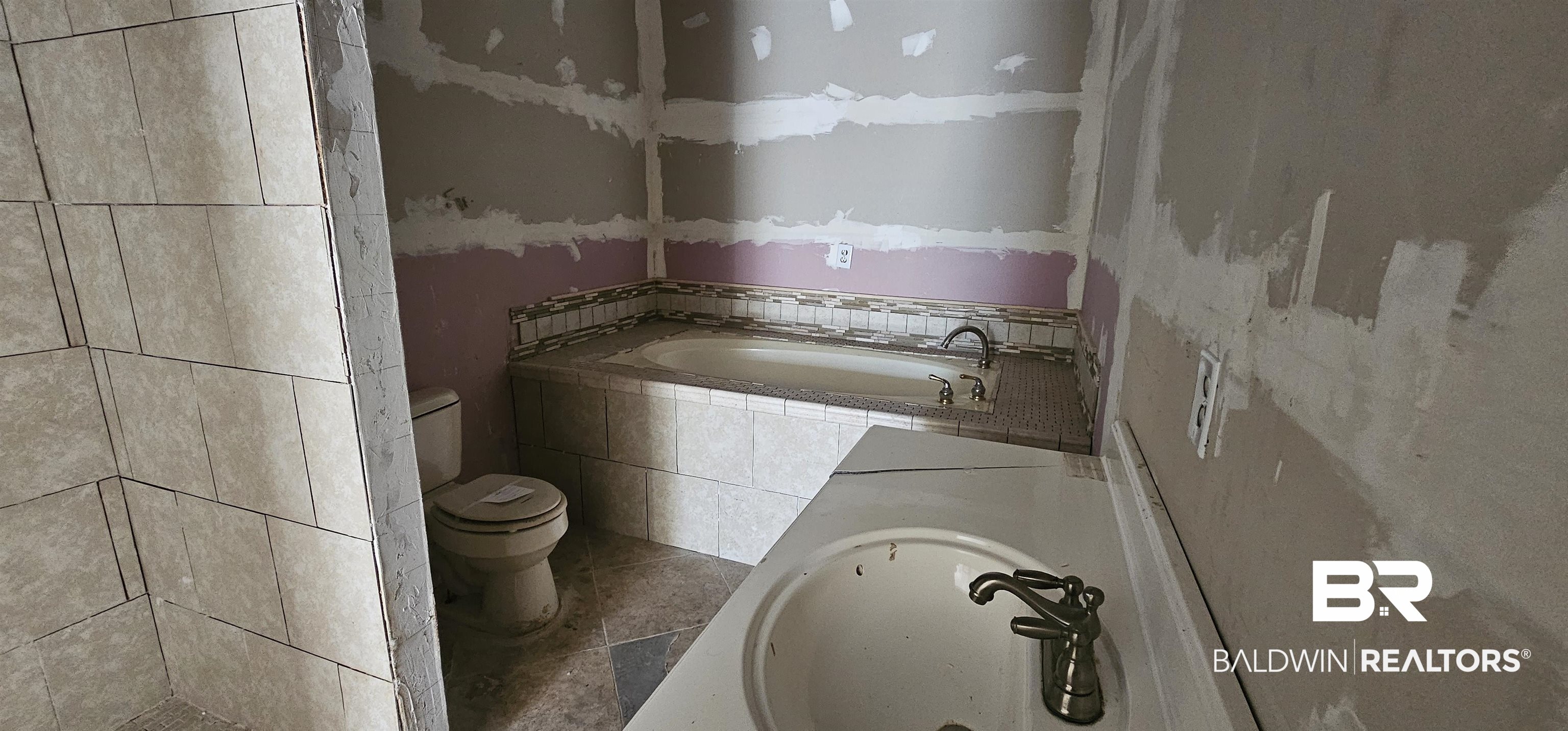 151 Bullard Street Atmore, AL 36502 - Photo 28 of 38 Full bathroom featuring a bath, vanity, and tile patterned flooring