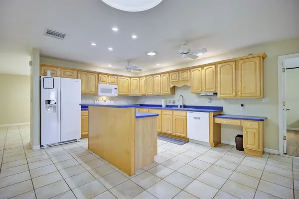 a kitchen with stainless steel appliances granite countertop a sink and cabinets