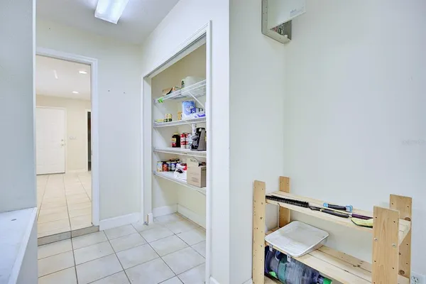 a kitchen with a sink a stove cabinets and refrigerator