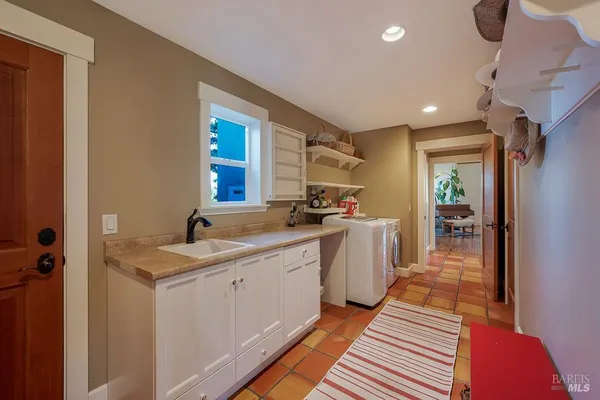 a view of a kitchen from the hallway