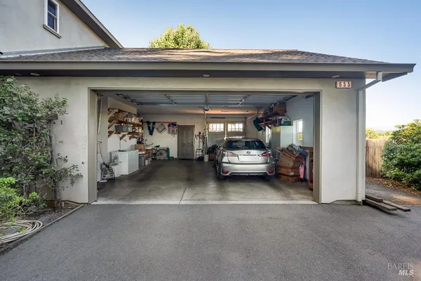 a view of a livingroom with furniture and a garage
