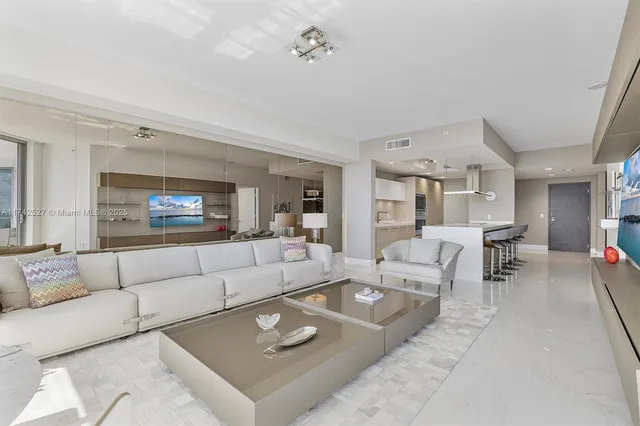 a living room with a large window and a table