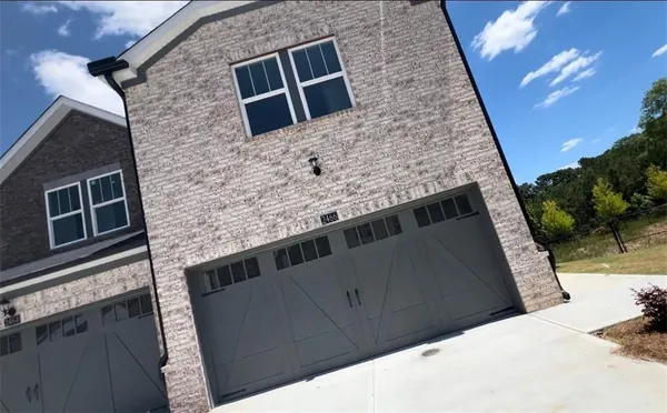 a view of a backyard of the house