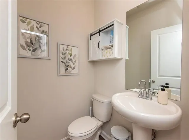 a living room with furniture kitchen view and a table
