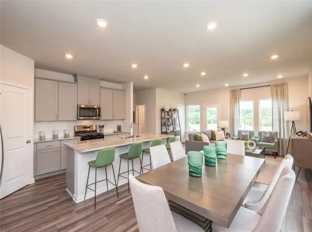 a kitchen with stainless steel appliances granite countertop a sink and dishwasher