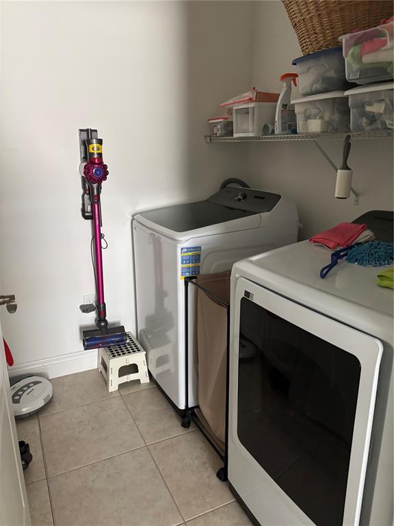 10923 Blue Magnolia Lane Parrish, FL 34219 - Photo 17 of 31 a utility room with dryer and washer
