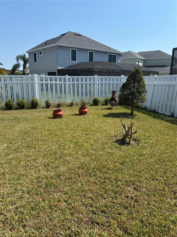 10923 Blue Magnolia Lane Parrish, FL 34219 - Photo 24 of 31 a view of a house with backyard and sitting area