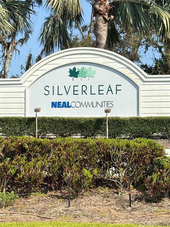 10923 Blue Magnolia Lane Parrish, FL 34219 - Photo 27 of 31 a sign on the side of the road