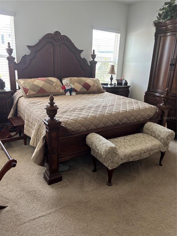 10923 Blue Magnolia Lane Parrish, FL 34219 - Photo 30 of 31 a bedroom with a bed and a couch