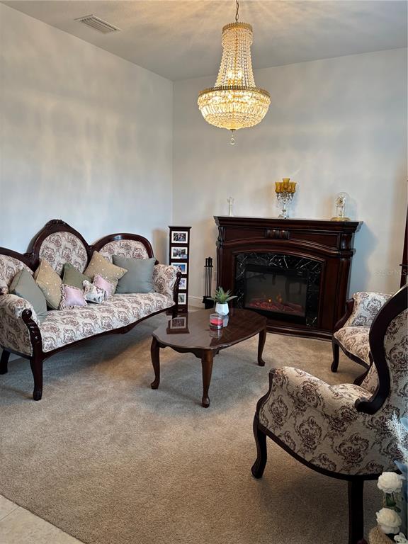10923 Blue Magnolia Lane Parrish, FL 34219 - Photo 4 of 31 a living room with furniture