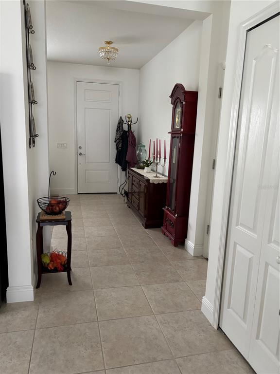 10923 Blue Magnolia Lane Parrish, FL 34219 - Photo 10 of 31 a living room with furniture and a gate