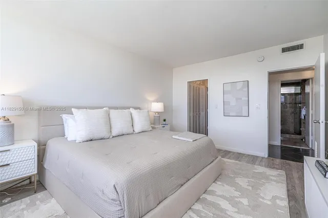 a bedroom with a bed and a walk in closet