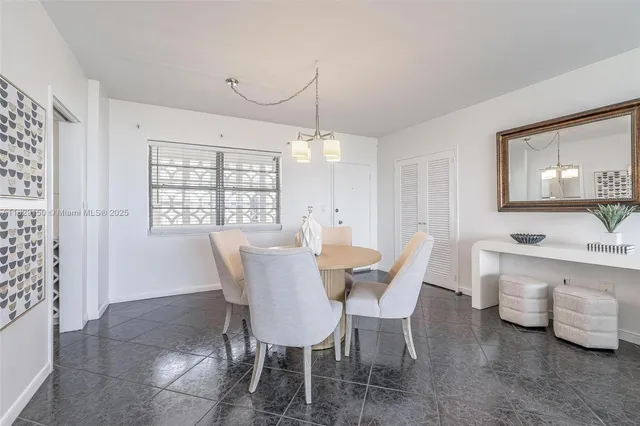 a view of a dining room with furniture and window
