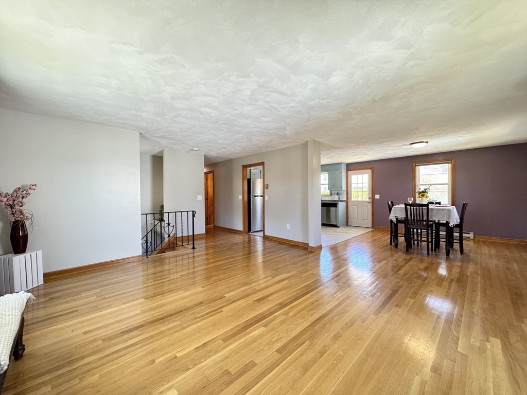 14 Maxdale Road Worcester, MA 01602 - Photo 13 of 42 a big room with wooden floor and dining table