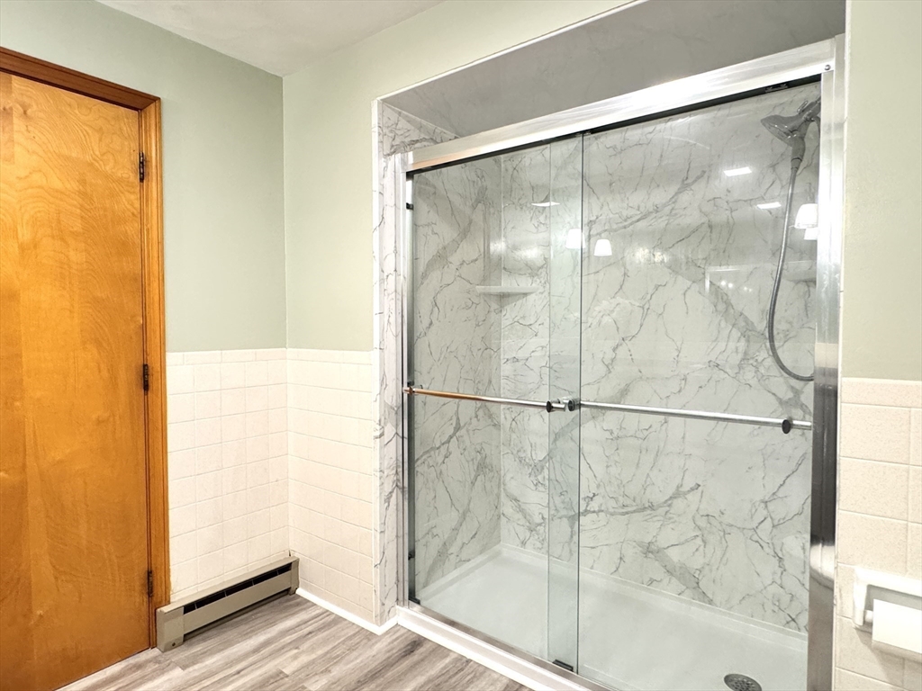 14 Maxdale Road Worcester, MA 01602 - Photo 17 of 42 a bathroom with a glass shower door