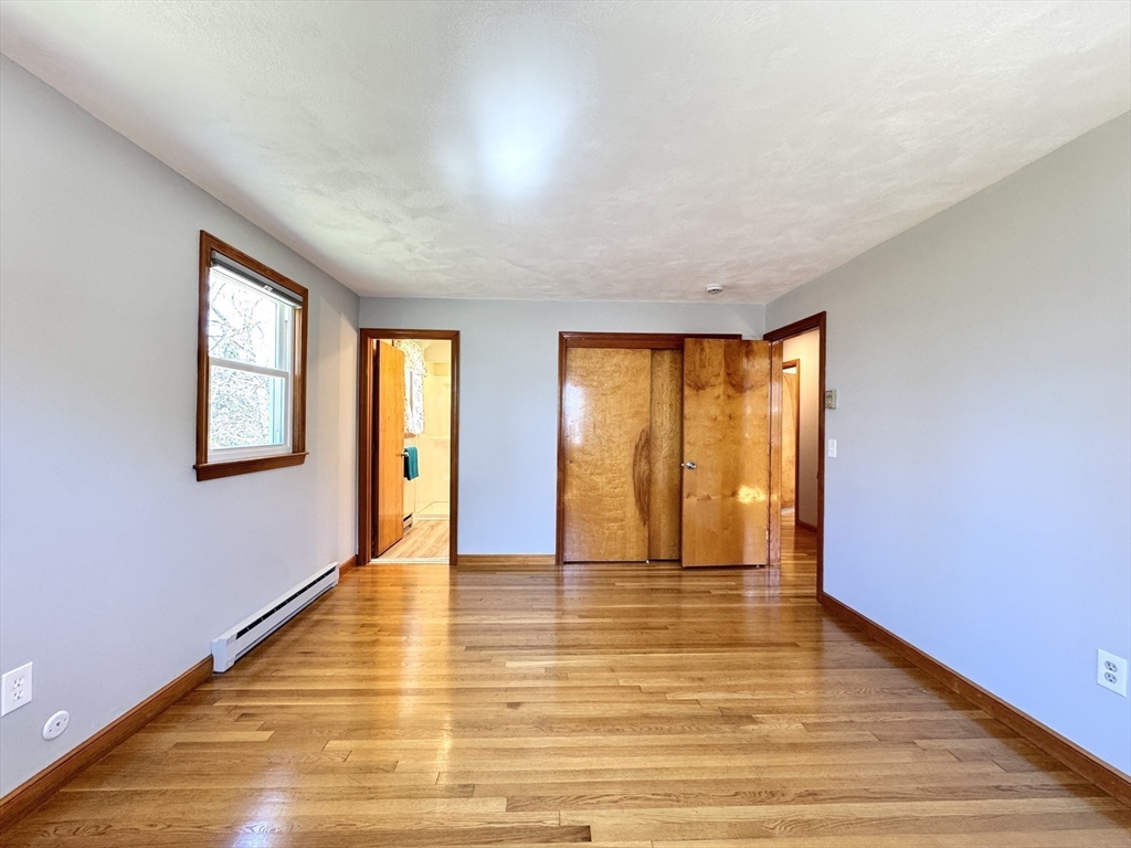 14 Maxdale Road Worcester, MA 01602 - Photo 19 of 42 a view of an empty room with wooden floor and a window
