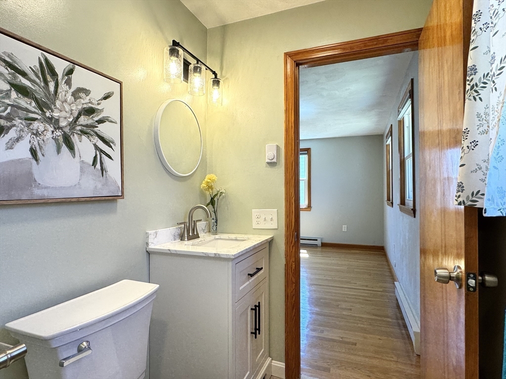 14 Maxdale Road Worcester, MA 01602 - Photo 20 of 42 a bathroom with a toilet sink and mirror