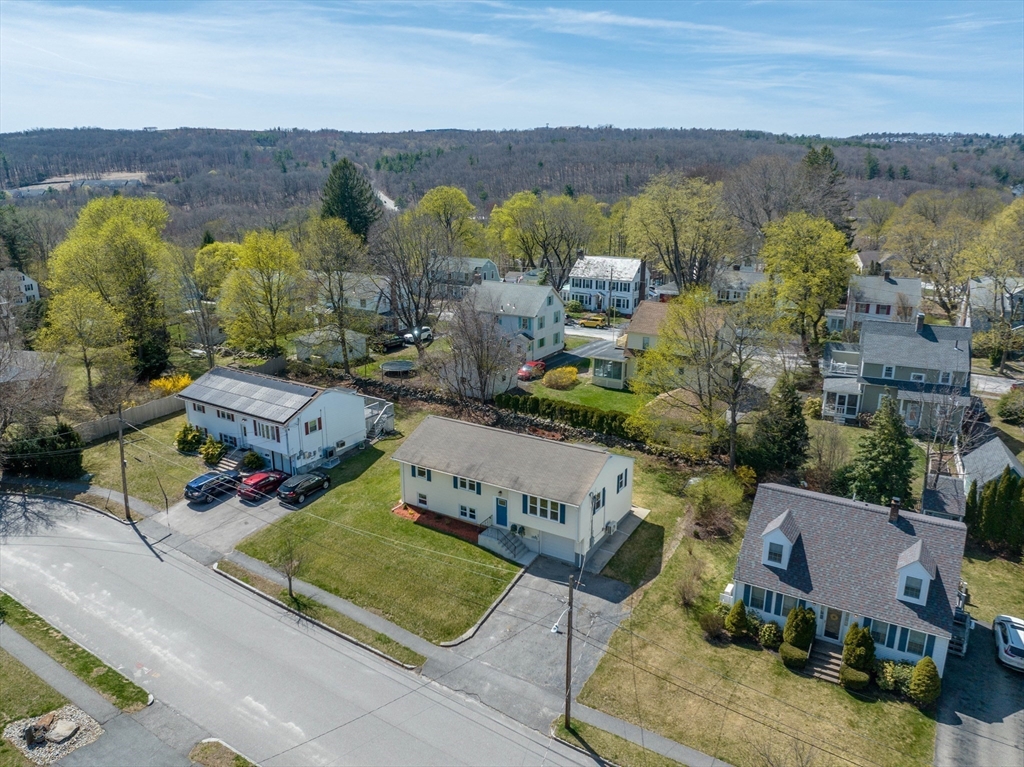 14 Maxdale Road Worcester, MA 01602 - Photo 2 of 42 an aerial view of a house with a garden and lake view