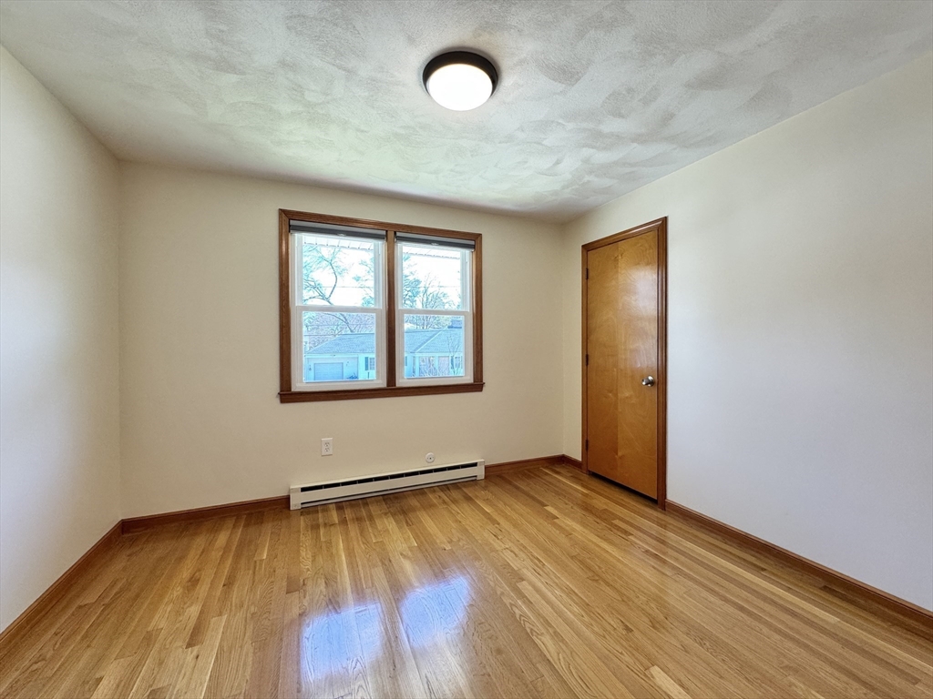 14 Maxdale Road Worcester, MA 01602 - Photo 24 of 42 an empty room with wooden floor and windows