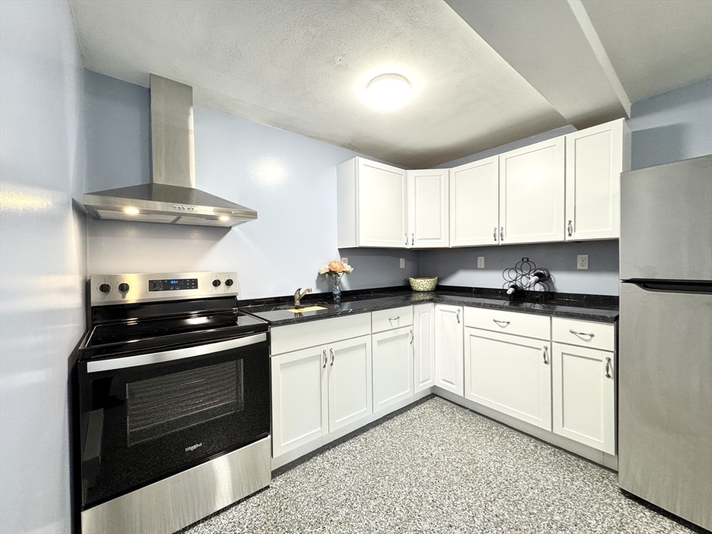 14 Maxdale Road Worcester, MA 01602 - Photo 27 of 42 a kitchen with stainless steel appliances granite countertop a stove and a sink
