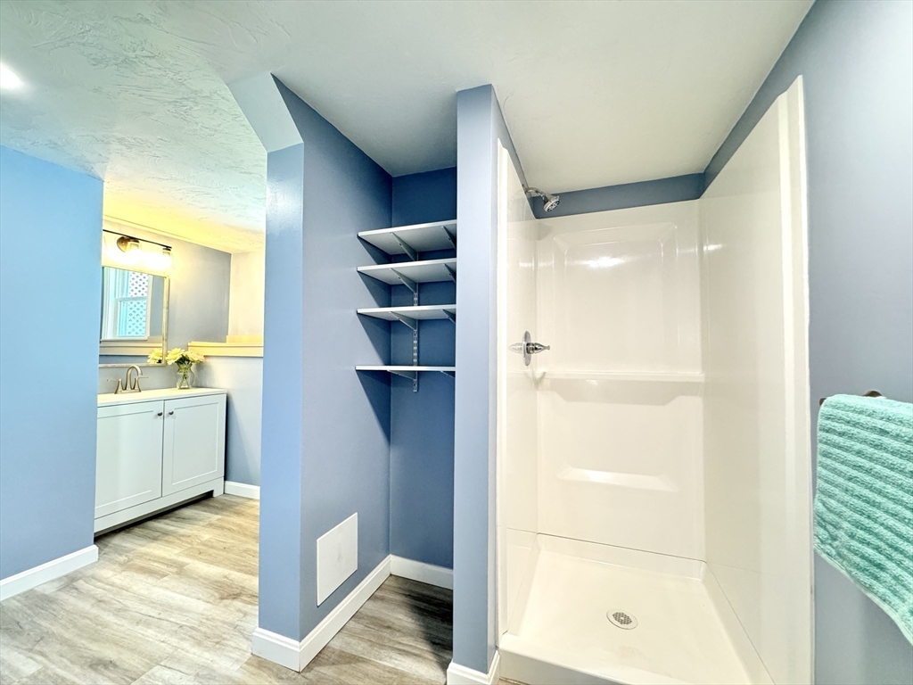 14 Maxdale Road Worcester, MA 01602 - Photo 30 of 42 a view of bathroom with a tub shower vanity and a sink