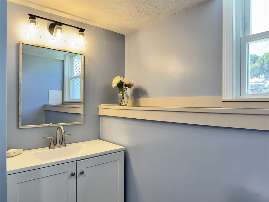 14 Maxdale Road Worcester, MA 01602 - Photo 31 of 42 a bathroom with a sink and a mirror