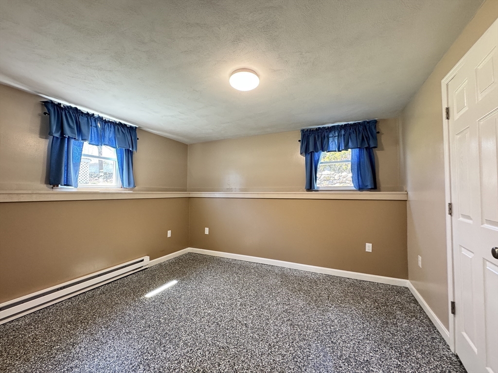14 Maxdale Road Worcester, MA 01602 - Photo 34 of 42 a view of an empty room with window and stairs
