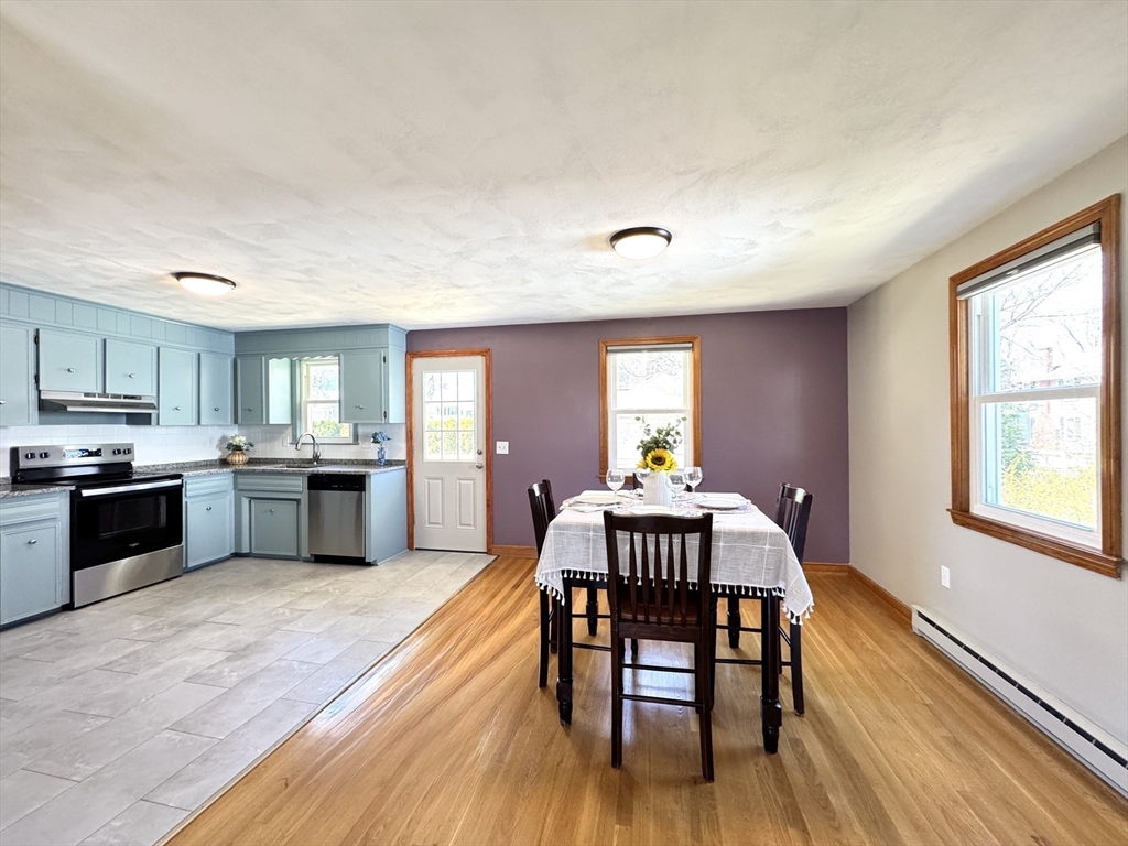 14 Maxdale Road Worcester, MA 01602 - Photo 7 of 42 a kitchen with stainless steel appliances granite countertop a kitchen island hardwood floor sink stove dining table and chairs