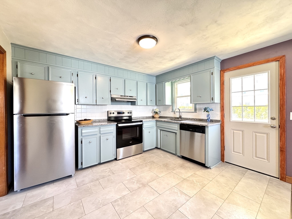 14 Maxdale Road Worcester, MA 01602 - Photo 8 of 42 a kitchen with granite countertop a refrigerator stove top oven and sink