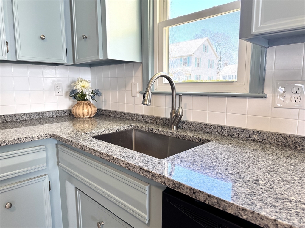 14 Maxdale Road Worcester, MA 01602 - Photo 10 of 42 a kitchen with granite countertop a sink and wooden cabinets