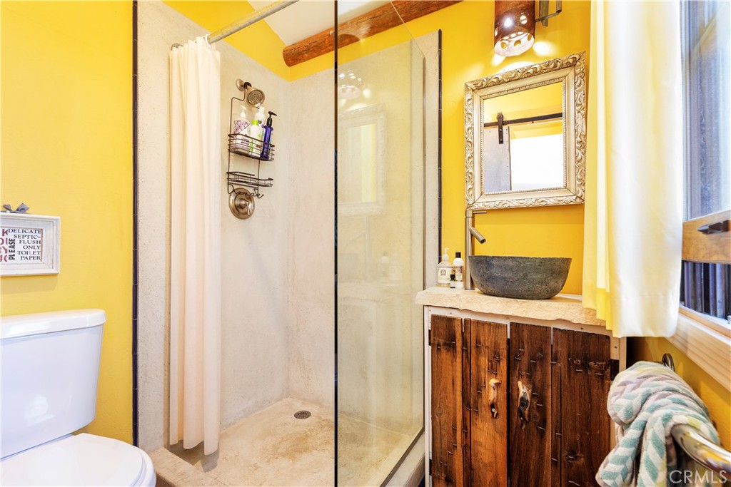 62238 Rincon Road Joshua Tree, CA 92252 - Photo 24 of 60 a bathroom with a toilet sink and a mirror